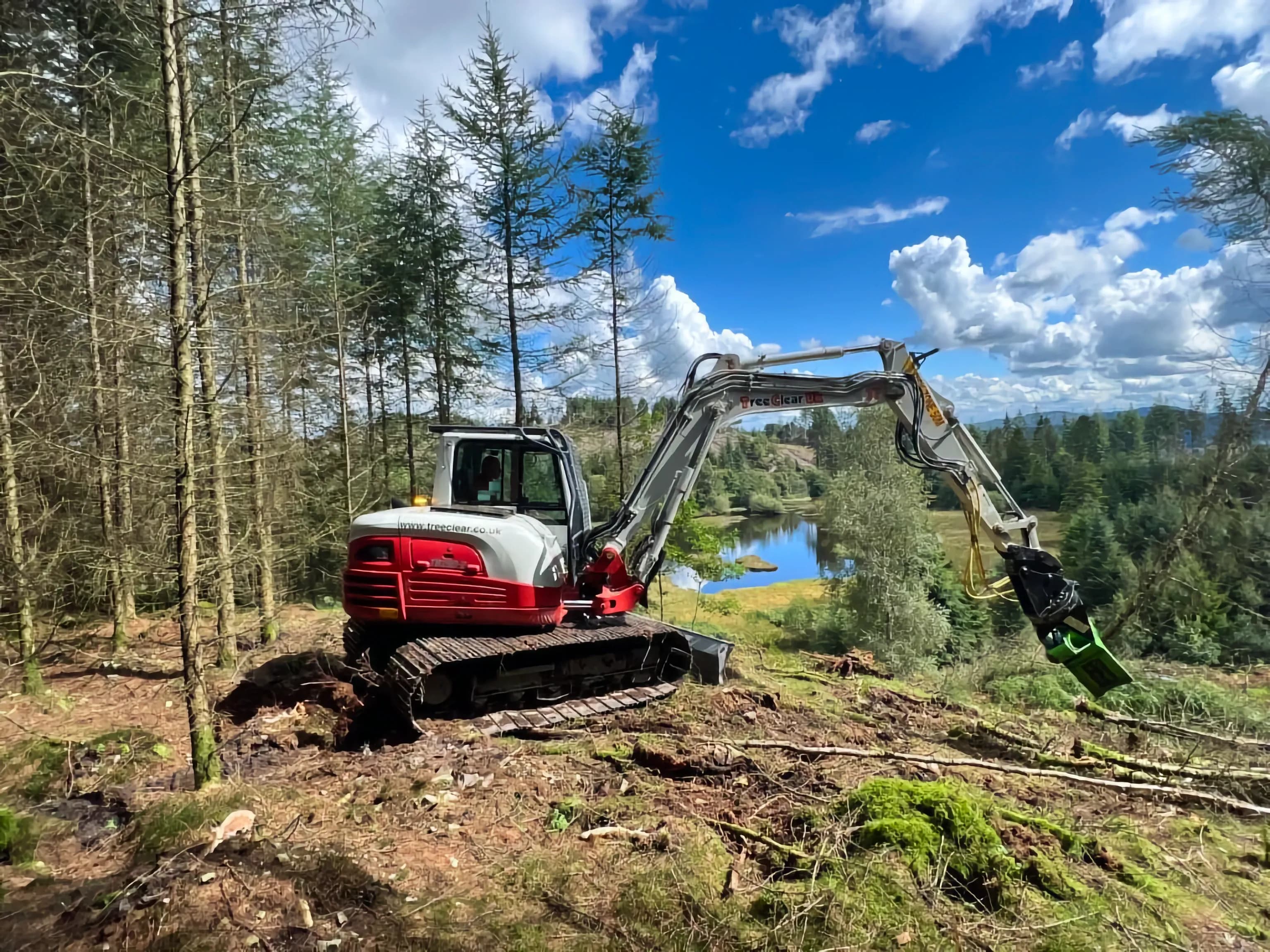 Treeclear UK vehicle clearing overgrown wooded area